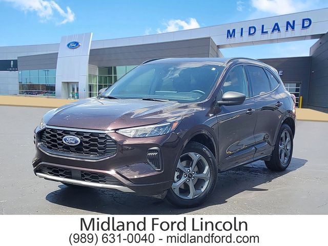 2023 Ford Escape ST-Line in Cinnabar Red — front three-quarter view